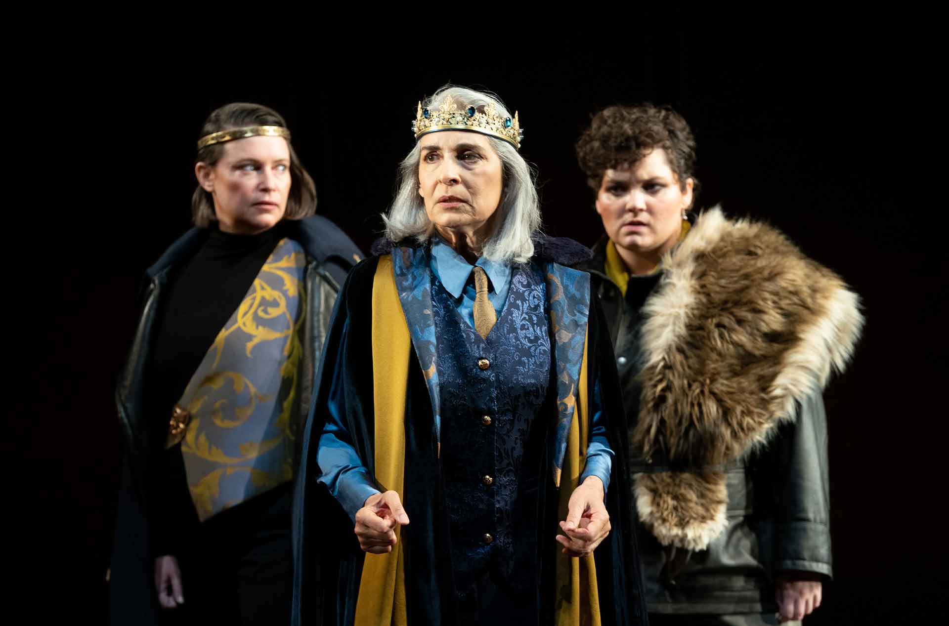 Three people looking into the distance.