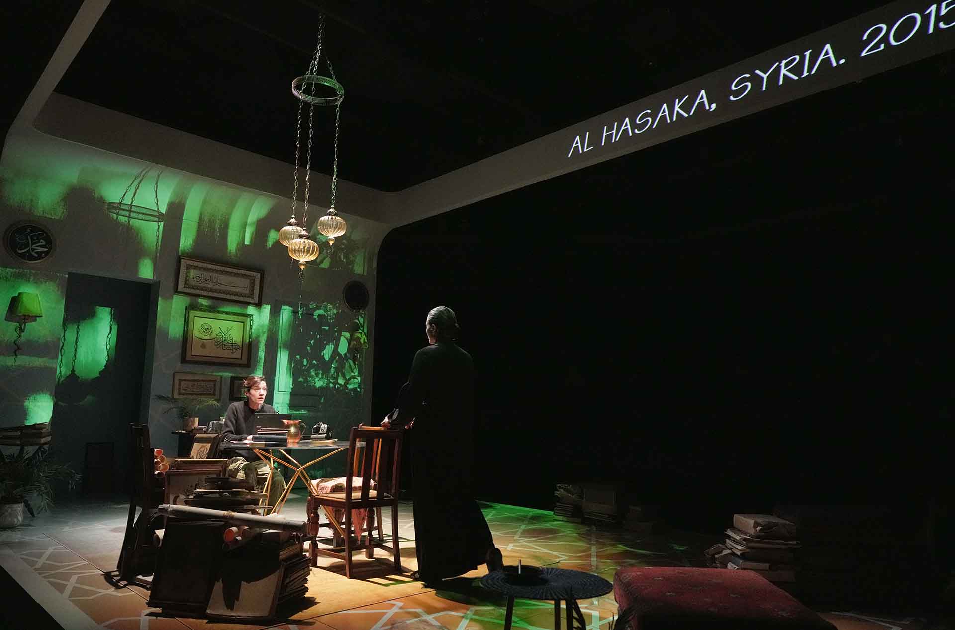 Two people having a discussion in an office.