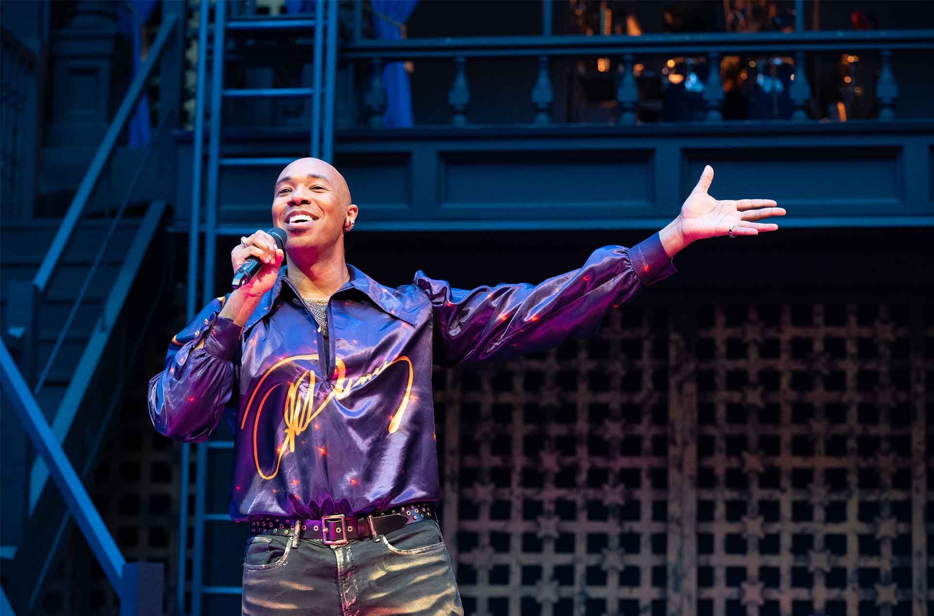 A person singing into a microphone.