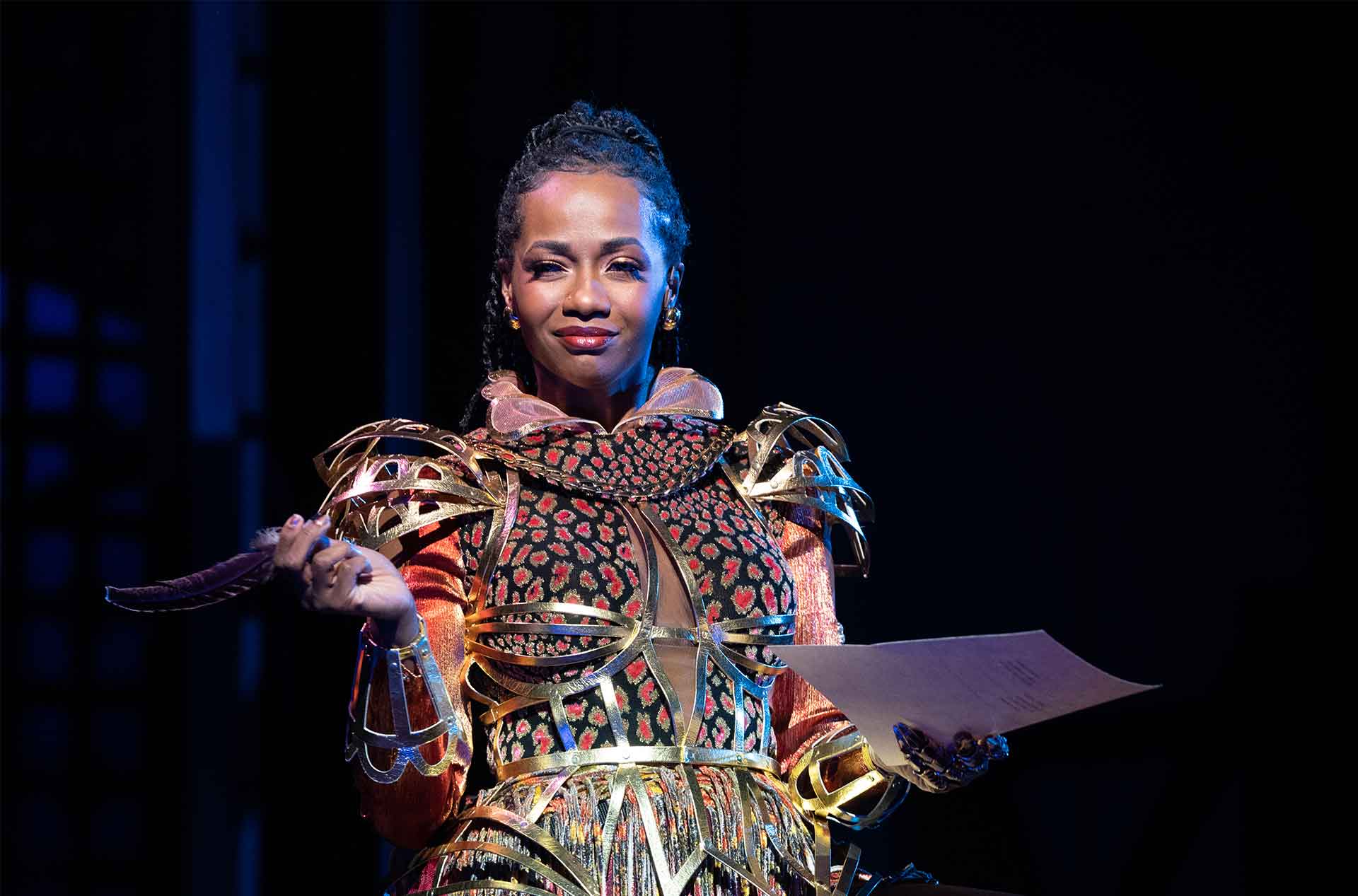 A person holding a list smirking. 