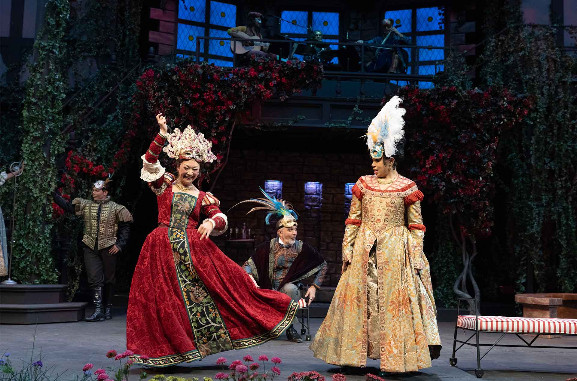 Two people in very fancy dresses dancing.