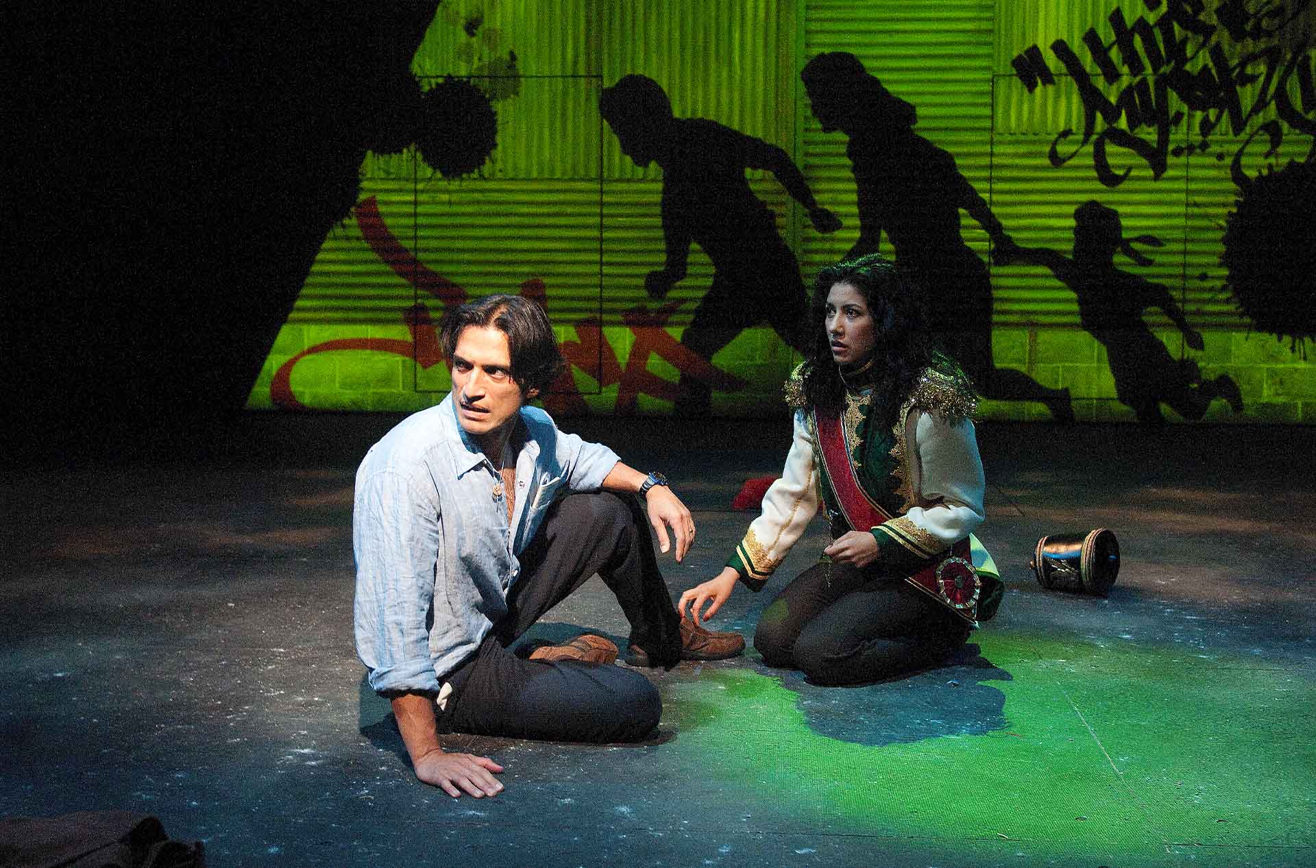 Two people sitting and looking concerned.