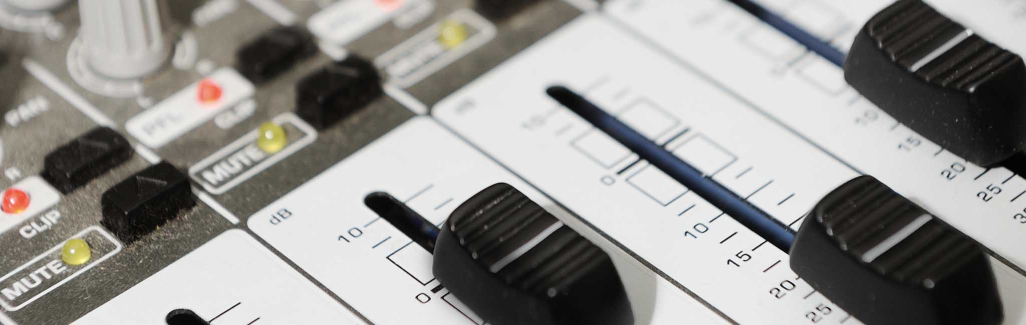 A close up of a sound board.