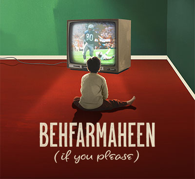 A boy sitting in front of a tv with a football game on.
