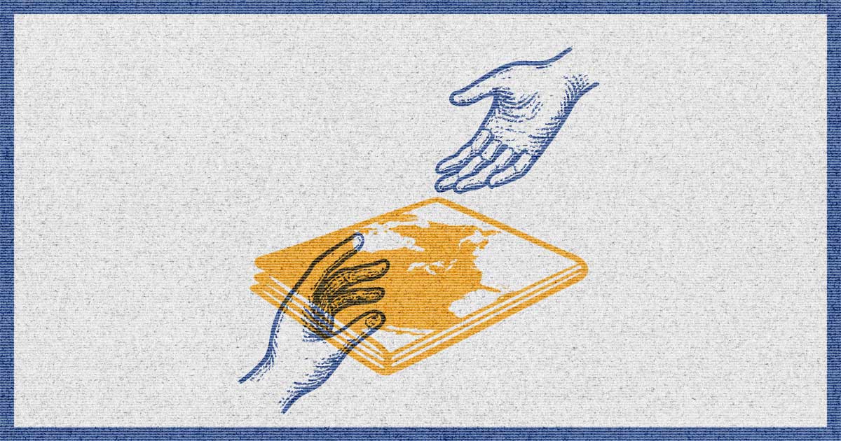 Two hands reaching for a newspaper with a world map on it, colored in orange and blue.